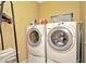 Laundry room with washer and dryer set, ideal for convenient laundry days at 4604 W Fig St # 1, Tampa, FL 33609