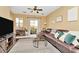 Inviting living room featuring a large sectional, sliding glass doors, and contemporary decor at 4604 W Fig St # 1, Tampa, FL 33609