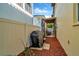 Cozy outdoor patio with pavers and mulch, featuring a grill and shaded seating area at 4604 W Fig St # 1, Tampa, FL 33609