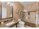 Bathroom featuring a glass-enclosed shower with a pebble floor and a vanity with a sink at 5599 Hidden Oak Ct, North Port, FL 34287