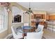 Cozy breakfast nook with seating for four, views of the kitchen, and an archway to the living room at 5599 Hidden Oak Ct, North Port, FL 34287