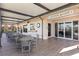 Exterior of Courtside Cafe featuring covered outdoor seating at Heron Creek Golf & Country Club at 5599 Hidden Oak Ct, North Port, FL 34287