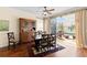 Dining area with a china cabinet and sliding glass doors providing access to the outdoor patio at 5599 Hidden Oak Ct, North Port, FL 34287