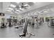 Bright fitness center with modern equipment overlooking the pool area at Heron Creek Golf & Country Club at 5599 Hidden Oak Ct, North Port, FL 34287