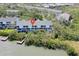 Aerial view of condos with waterfront access and picturesque views of surrounding nature at 9874 Indian Key Trl # 62, Seminole, FL 33776