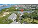 Stunning aerial view of condos and community in waterfront setting with lush landscaping and waterway access at 9874 Indian Key Trl # 62, Seminole, FL 33776