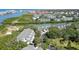 Stunning aerial view of condos and community in waterfront setting with lush landscaping and waterway access at 9874 Indian Key Trl # 62, Seminole, FL 33776