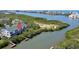 Waterfront condo aerial view with docks, balconies, and stunning views of the adjacent waterway at 9874 Indian Key Trl # 62, Seminole, FL 33776