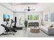 Finished basement with workout equipment and a cozy seating area at 9874 Indian Key Trl # 62, Seminole, FL 33776