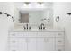 Bathroom vanity with double sinks, quartz countertops, and modern fixtures at 9874 Indian Key Trl # 62, Seminole, FL 33776