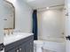 Beautiful bathroom with shower over tub and modern vanity at 9874 Indian Key Trl # 62, Seminole, FL 33776