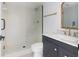 Updated bathroom with glass shower, marble counter, and modern fixtures at 9874 Indian Key Trl # 62, Seminole, FL 33776