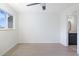 A bright bedroom with light wood floors and an en suite bathroom at 9874 Indian Key Trl # 62, Seminole, FL 33776