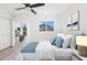 Cozy bedroom features ample natural light, a comfortable bed, and a connected office at 9874 Indian Key Trl # 62, Seminole, FL 33776