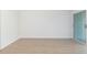 Bright bedroom with light wood floors and sliding glass doors at 9874 Indian Key Trl # 62, Seminole, FL 33776
