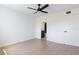 Light and airy bedroom with wood floors and a ceiling fan at 9874 Indian Key Trl # 62, Seminole, FL 33776