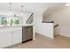 Beautiful kitchen with stainless steel dishwasher and a staircase to the second level at 9874 Indian Key Trl # 62, Seminole, FL 33776