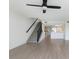 Spacious open-concept living area with staircase access at 9874 Indian Key Trl # 62, Seminole, FL 33776