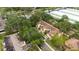 Aerial view of townhomes with mature trees, landscaping, and nearby roadways at 10821 Great Carlisle Ct, Riverview, FL 33578