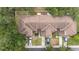 Aerial view of townhomes with mature trees and a community parking lot at 10821 Great Carlisle Ct, Riverview, FL 33578
