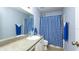 Bathroom featuring a shower with blue checked curtains at 10821 Great Carlisle Ct, Riverview, FL 33578