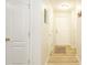 Hallway with white doors and tan walls at 10821 Great Carlisle Ct, Riverview, FL 33578