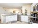 Kitchen with white cabinets and stainless steel dishwasher at 10821 Great Carlisle Ct, Riverview, FL 33578