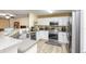 Kitchen featuring modern stainless steel appliances and white cabinets at 10821 Great Carlisle Ct, Riverview, FL 33578