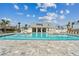 Resort-style pool features a spacious deck with lounge chairs and a modern pool house for the neighborhood at 1758 Spreader Ln, Sarasota, FL 34240