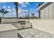 Community outdoor grill area featuring a built-in grill, granite countertops, and ample space at 1758 Spreader Ln, Sarasota, FL 34240