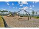 Outdoor playground with swings and climbing structures for recreation at 1758 Spreader Ln, Sarasota, FL 34240
