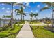 Pathway leading to community amenities, surrounded by well-maintained lawns and landscaping at 1758 Spreader Ln, Sarasota, FL 34240