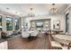 Community clubhouse showcases a spacious lounge area with modern furnishings, decorative lighting, and a cozy window nook at 18068 Cherished Loop, Bradenton, FL 34211