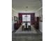 The dining room features a modern chandelier, an area rug, and a dark-colored accent wall at 227 Heritage Preserve Run, Bradenton, FL 34212