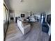 Open-concept living room featuring tile floors, neutral paint, recessed lights, and sliding glass doors at 227 Heritage Preserve Run, Bradenton, FL 34212