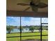 Enjoy scenic water views from this screened lanai with a ceiling fan and black aluminum screen at 227 Heritage Preserve Run, Bradenton, FL 34212