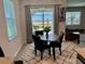 Bright dining area features a modern table with seating for four, and sliding glass doors at 43819 Cattleman Dr, Punta Gorda, FL 33982