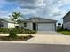 Charming single-Gathering home with a two-car garage, paver driveway and well-manicured landscaping at 43819 Cattleman Dr, Punta Gorda, FL 33982