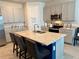Spacious kitchen island with seating, stainless steel appliances, and modern cabinetry at 43819 Cattleman Dr, Punta Gorda, FL 33982