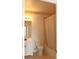 Cozy bathroom featuring a vanity, toilet, and shower with neutral-colored tile and gold accents at 5613 Legacy Crescent Pl # 201, Riverview, FL 33578