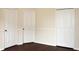 This bedroom has neutral paint, chair rail and two doors at 5613 Legacy Crescent Pl # 201, Riverview, FL 33578