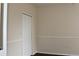 This bedroom has neutral paint, chair rail and a closet with bi-fold doors at 5613 Legacy Crescent Pl # 201, Riverview, FL 33578