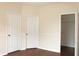 This bedroom has neutral paint, chair rail, two doors and a walk-in closet at 5613 Legacy Crescent Pl # 201, Riverview, FL 33578