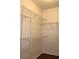 Walk-in closet with wire shelving for organized storage of clothes and accessories at 5613 Legacy Crescent Pl # 201, Riverview, FL 33578