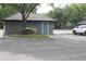 Exterior door on community building, with surrounding green landscaping and ample parking at 5613 Legacy Crescent Pl # 201, Riverview, FL 33578