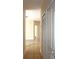 This hallway has tile flooring and several doors at 5613 Legacy Crescent Pl # 201, Riverview, FL 33578