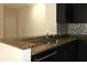 Kitchen featuring granite counters, stainless steel appliances, and dark cabinetry at 5613 Legacy Crescent Pl # 201, Riverview, FL 33578