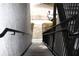 Staircase with metal railings and concrete steps leading to the parking lot at 5613 Legacy Crescent Pl # 201, Riverview, FL 33578