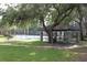 Community tennis courts and gazebo set amidst beautifully maintained lawns and mature trees at 5613 Legacy Crescent Pl # 201, Riverview, FL 33578