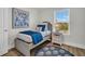 Inviting bedroom with a cozy bed, stylish nightstand, and a window overlooking lush greenery, creating a tranquil retreat at 13610 Wolfpack Rd, Hudson, FL 34667